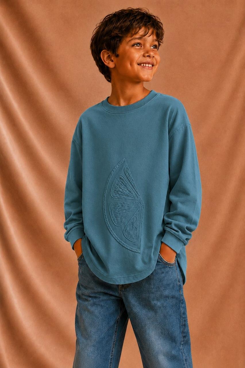 Child in blue Coucou Maman sweatshirt