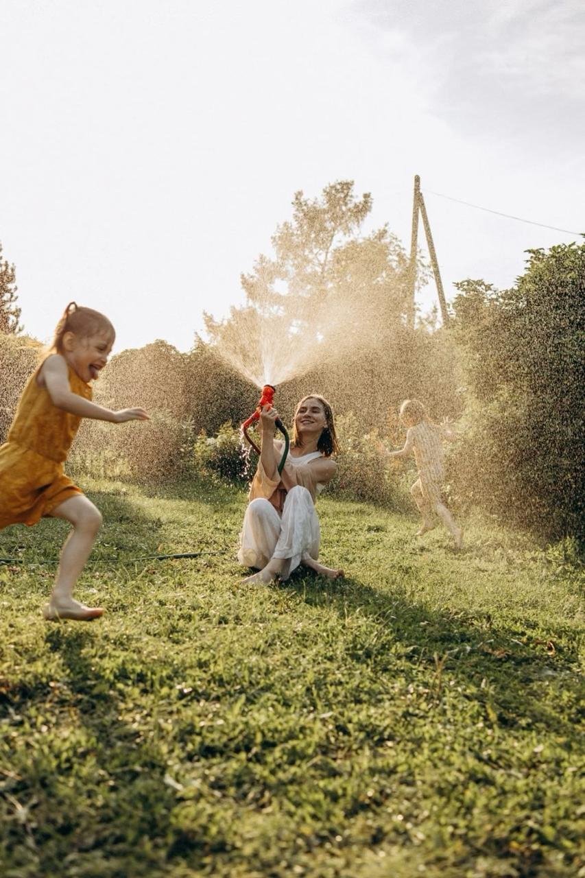 Child playing outdoors with a paper plane